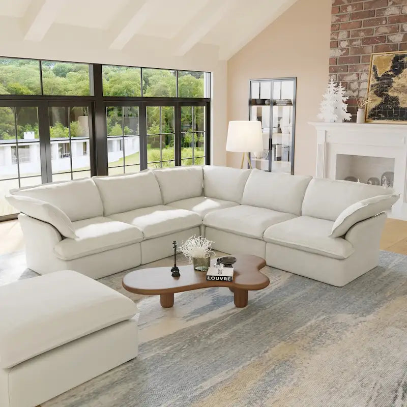 Canapé d'angle moderne en lin avec pouf, en forme de L.