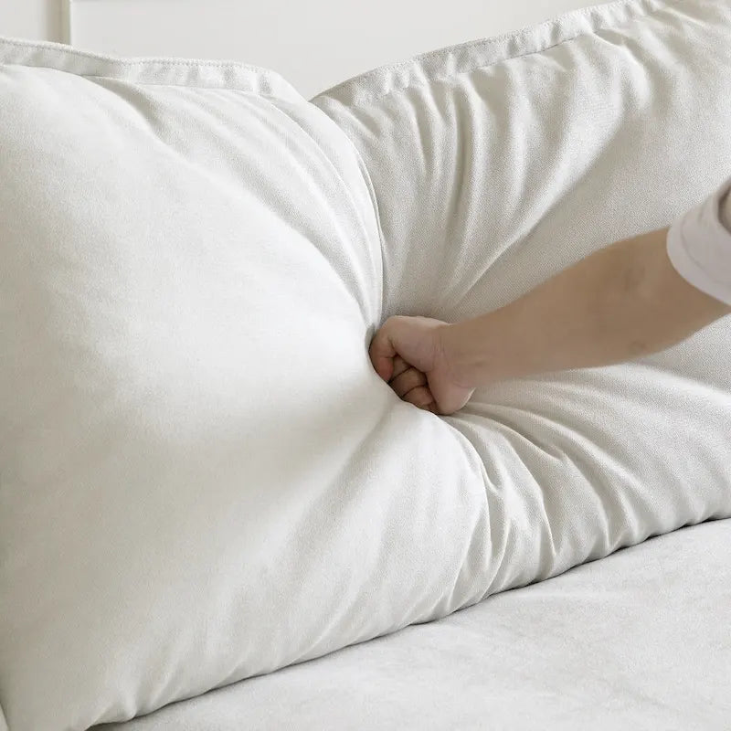 Canapé d'angle moderne en lin avec pouf, en forme de L.