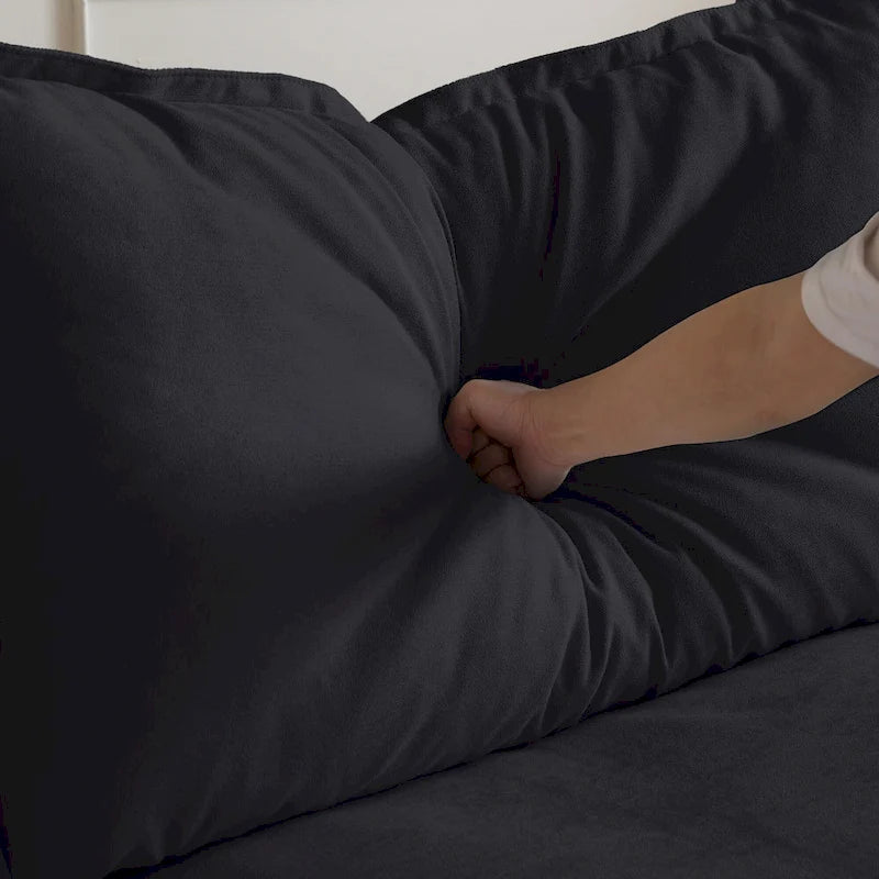 Canapé d'angle moderne en lin avec pouf, en forme de L.