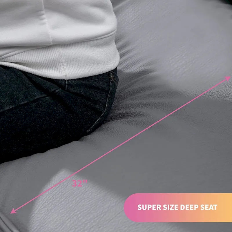 Canapé Mixoy 4 places à assise profonde et rembourrée, style italien minimaliste, 97 cm, avec accoudoirs en forme d'oreilles d'éléphant et coussin décoratif.