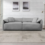 Canapé Mixoy 4 places à assise profonde et rembourrée, style italien minimaliste, 97 cm, avec accoudoirs en forme d'oreilles d'éléphant et coussin décoratif.