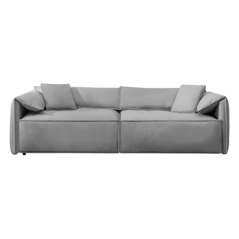 Canapé Mixoy 4 places à assise profonde et rembourrée, style italien minimaliste, 97 cm, avec accoudoirs en forme d'oreilles d'éléphant et coussin décoratif.