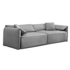Canapé Mixoy 4 places à assise profonde et rembourrée, style italien minimaliste, 97 cm, avec accoudoirs en forme d'oreilles d'éléphant et coussin décoratif.