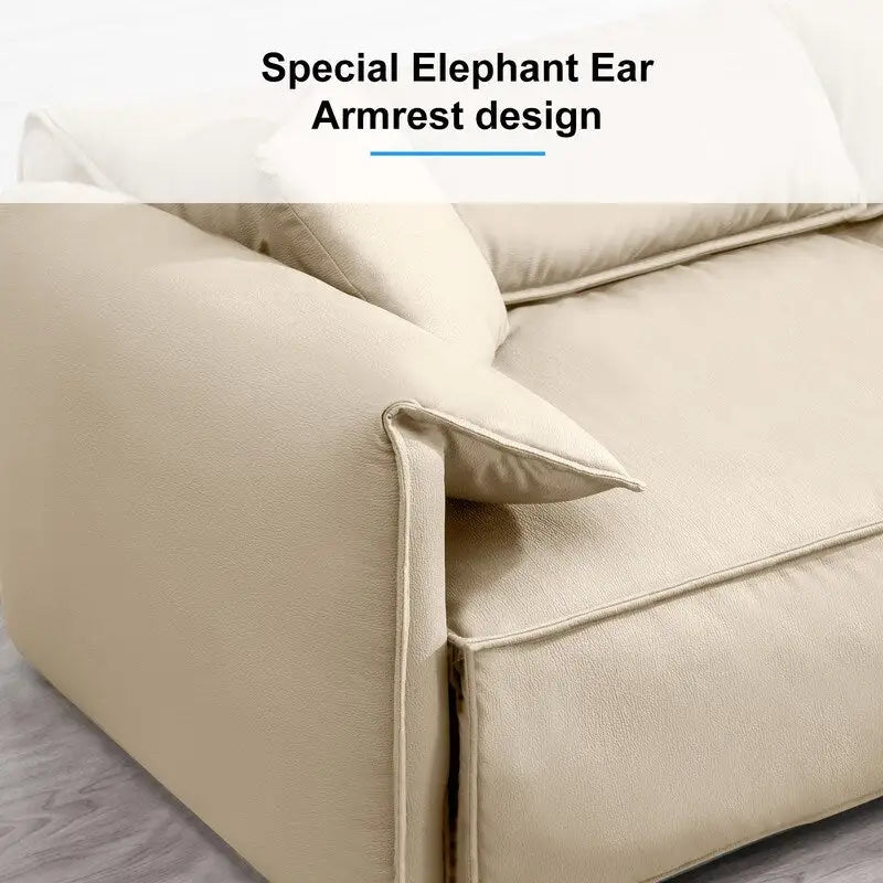 Canapé Mixoy 4 places à assise profonde et rembourrée, style italien minimaliste, 97 cm, avec accoudoirs en forme d'oreilles d'éléphant et coussin décoratif.