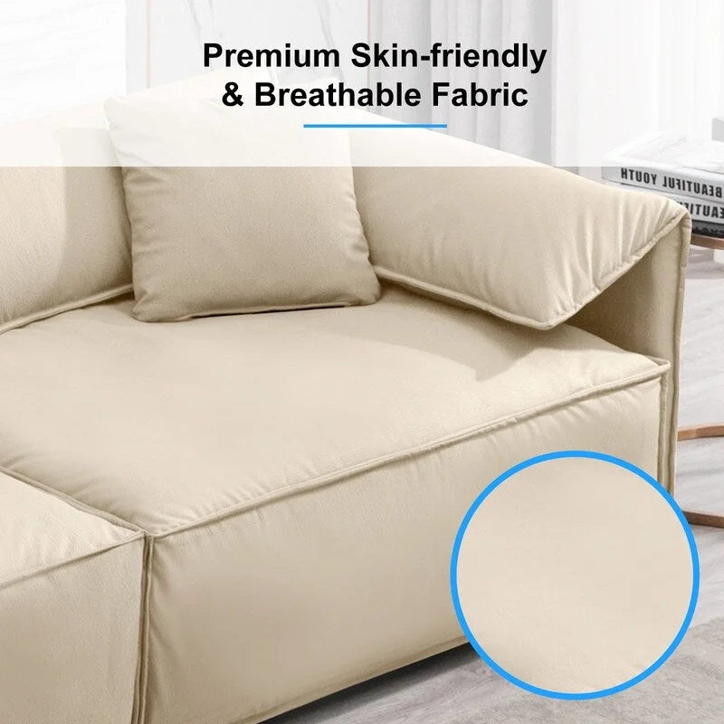 Canapé Mixoy 4 places à assise profonde et rembourrée, style italien minimaliste, 97 cm, avec accoudoirs en forme d'oreilles d'éléphant et coussin décoratif.