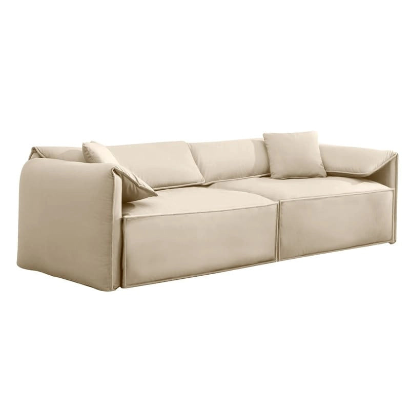 Canapé Mixoy 4 places à assise profonde et rembourrée, style italien minimaliste, 97 cm, avec accoudoirs en forme d'oreilles d'éléphant et coussin décoratif.