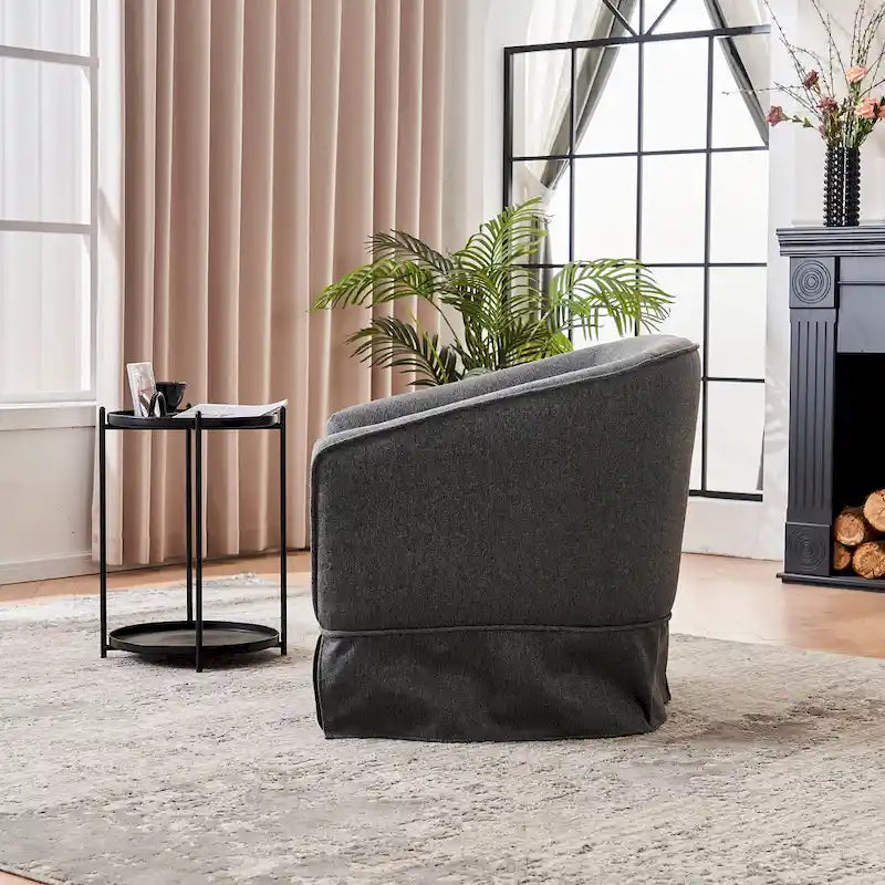 Fauteuil pivotant rond avec repose-pieds, idéal pour la lecture au salon ou dans la chambre, avec un piètement en métal noir.